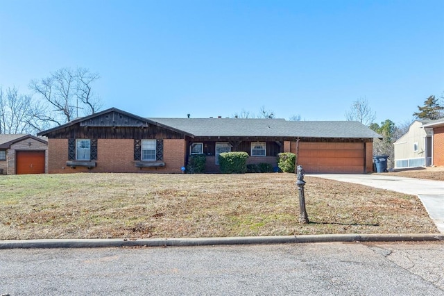 ranch-style house with a garage and a front yard