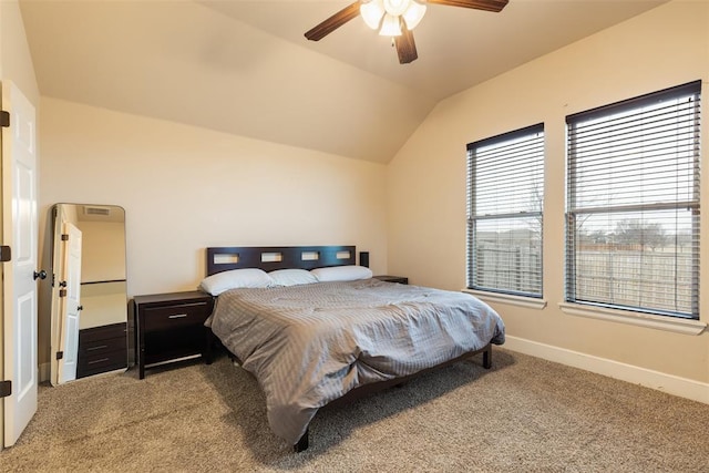 bedroom featuring ceiling fan, vaulted ceiling, and carpet