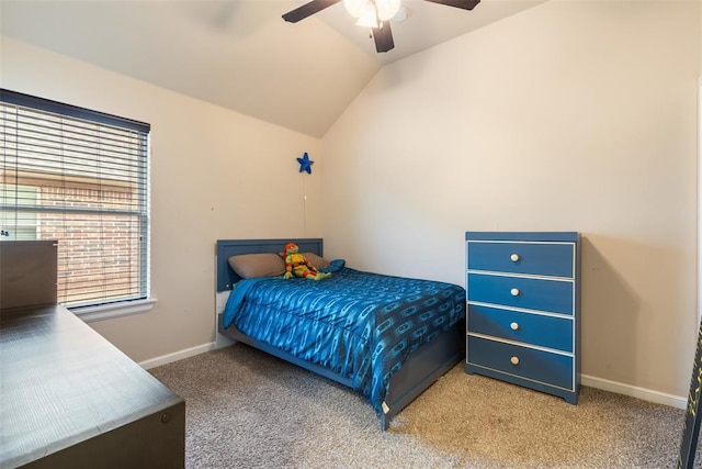 carpeted bedroom featuring vaulted ceiling and ceiling fan