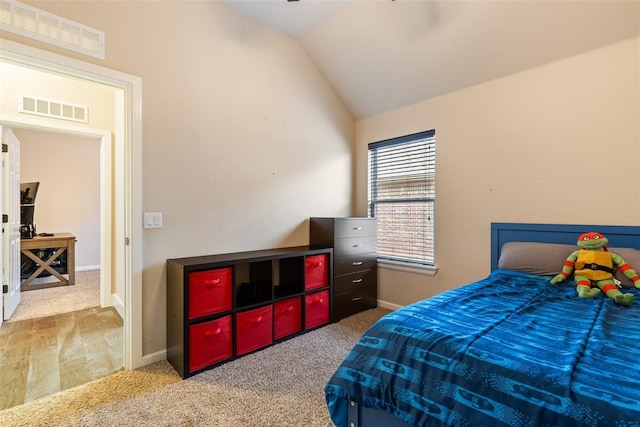 bedroom featuring carpet and lofted ceiling