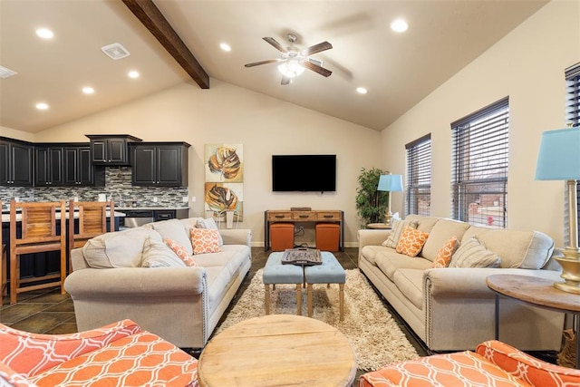 tiled living room with ceiling fan and vaulted ceiling with beams