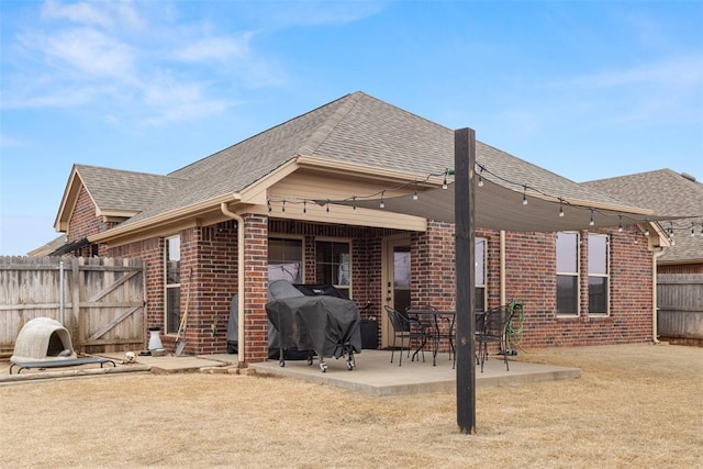 back of property with a patio