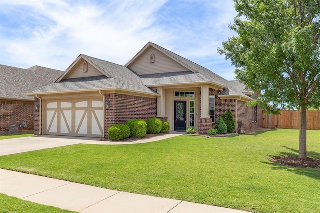 3524 Mount Mitchell Ln, Norman, OK 73069 - view of front of home with brick siding, an attached garage, roof with shingles, and driveway
