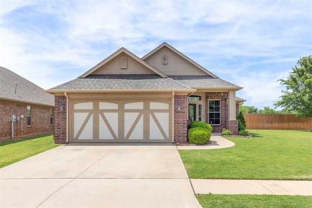 3524 Mount Mitchell Ln, Norman, OK 73069 - view of front of home with brick siding, a shingled roof, an attached garage, and driveway