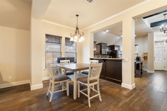 3524 Mount Mitchell Ln, Norman, OK 73069 - dining room featuring a chandelier, baseboards, dark wood finished floors, and ornamental molding