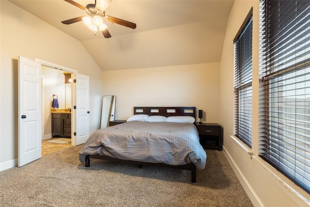 3524 Mount Mitchell Ln, Norman, OK 73069 - carpeted bedroom with vaulted ceiling, connected bathroom, a ceiling fan, and baseboards