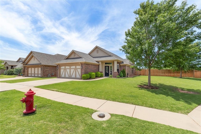 3524 Mount Mitchell Ln, Norman, OK 73069 - view of front of house featuring a garage, driveway, and brick siding
