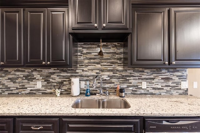 3524 Mount Mitchell Ln, Norman, OK 73069 - kitchen featuring a sink, dishwashing machine, dark brown cabinets, and decorative backsplash