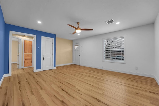 empty room featuring light hardwood / wood-style floors and ceiling fan