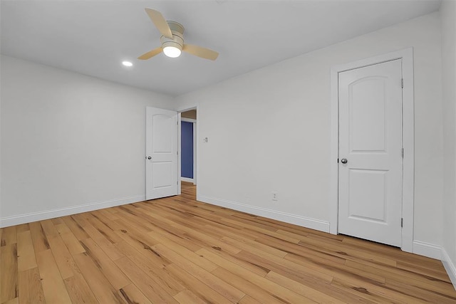 unfurnished room with ceiling fan and light hardwood / wood-style flooring