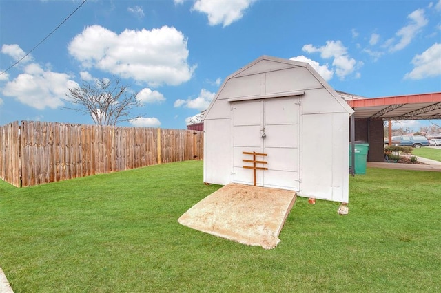 view of outbuilding featuring a lawn