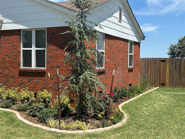 view of property exterior featuring a yard