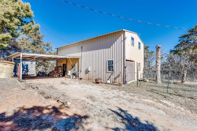 view of side of home with a garage