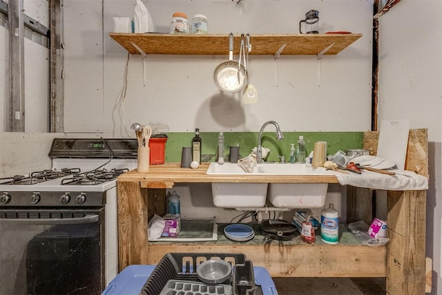 kitchen featuring sink and gas range oven