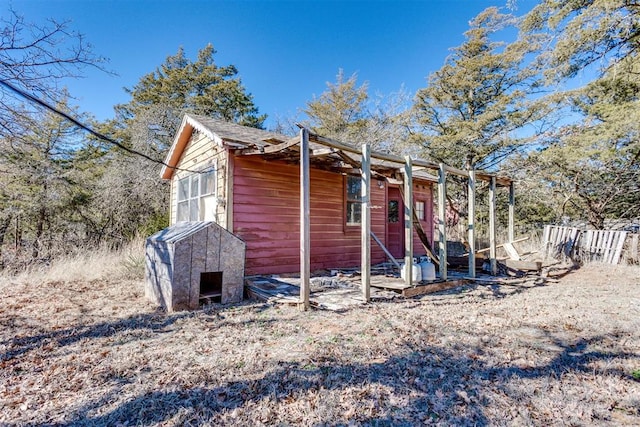 view of front of property with a shed