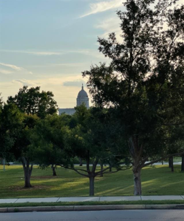 view of property's community featuring a yard