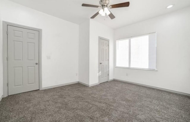 unfurnished bedroom with ceiling fan and carpet flooring