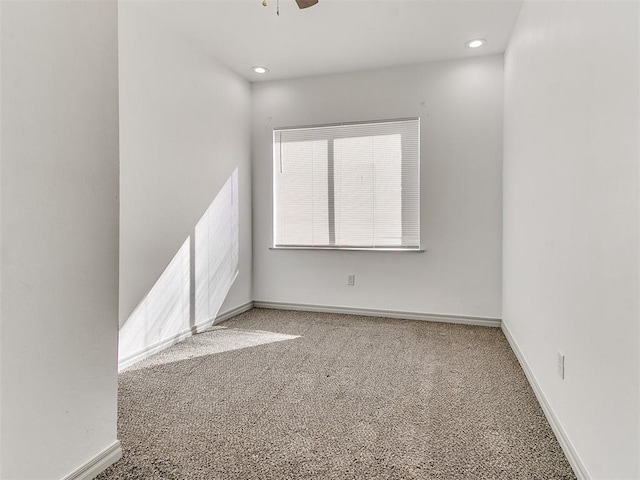 unfurnished room with recessed lighting, carpet flooring, a ceiling fan, and baseboards