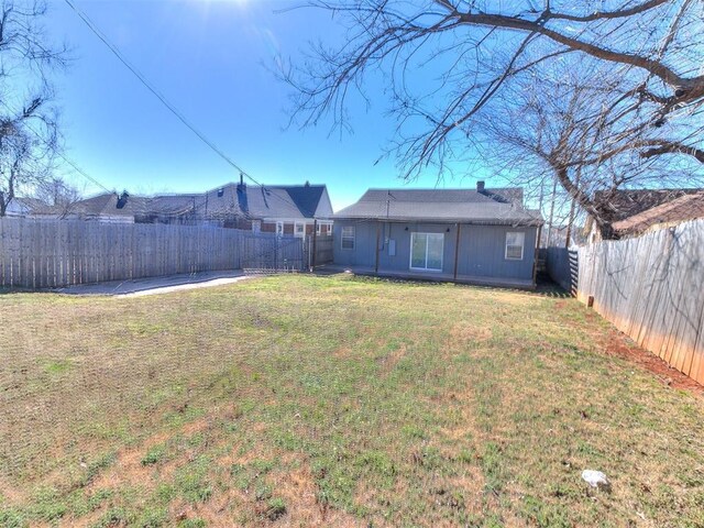 view of yard with a fenced backyard