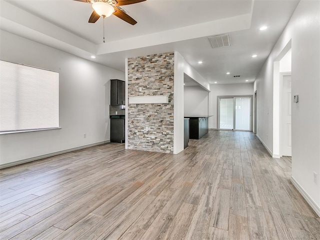 unfurnished living room with light wood-style flooring, recessed lighting, visible vents, baseboards, and a ceiling fan