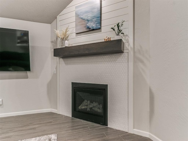 interior details featuring hardwood / wood-style floors and a textured ceiling