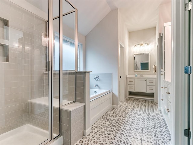 bathroom featuring vanity, plus walk in shower, and vaulted ceiling