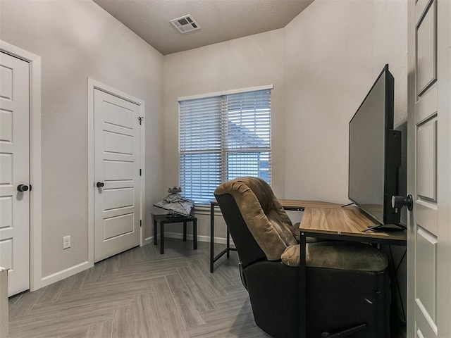 home office with light parquet floors