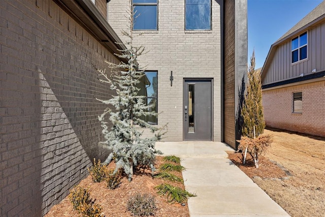 property entrance featuring a patio area