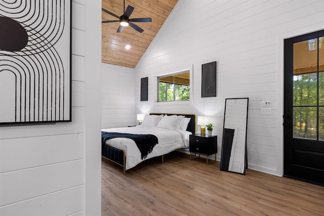 bedroom with hardwood / wood-style flooring, wooden ceiling, and high vaulted ceiling