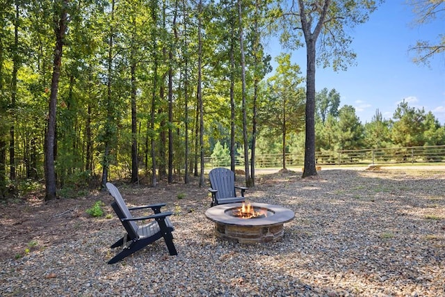 view of yard featuring a fire pit