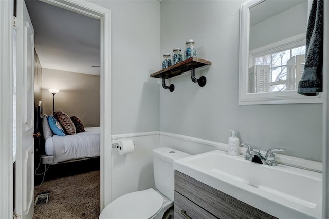 bathroom featuring vanity and toilet