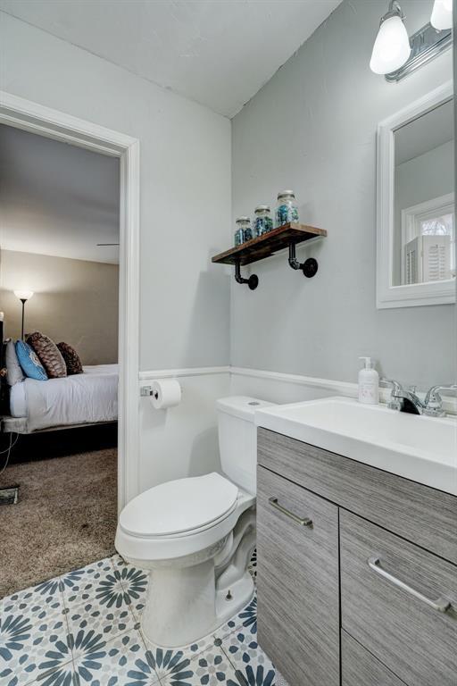 bathroom with vanity and toilet