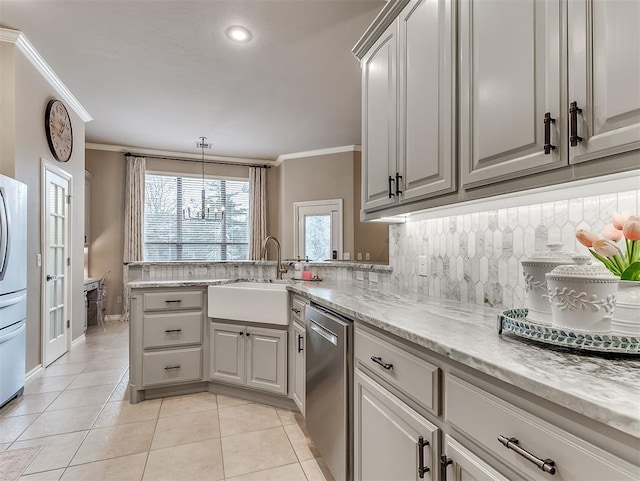 kitchen featuring sink, decorative backsplash, ornamental molding, and appliances with stainless steel finishes