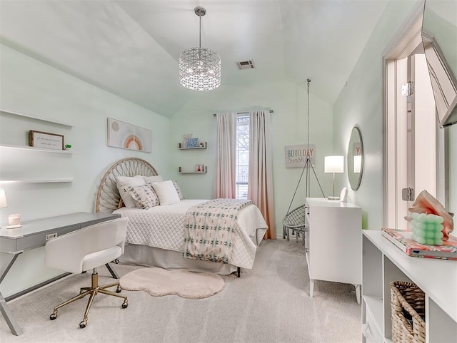 carpeted bedroom with vaulted ceiling and a notable chandelier