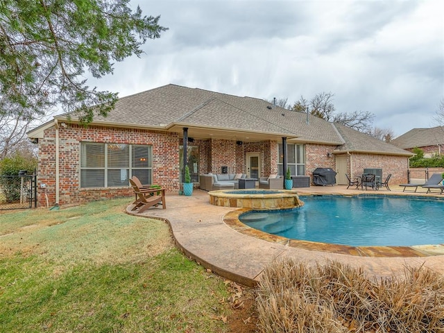 view of pool featuring an in ground hot tub, a grill, a patio, and a lawn