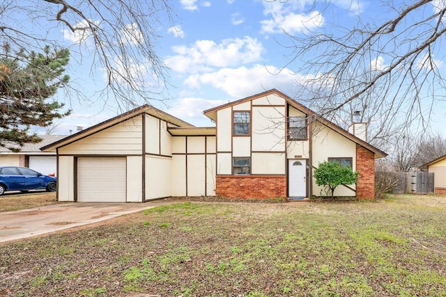 view of front of house with a garage and a front lawn