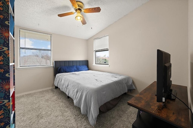 bedroom featuring light carpet, ceiling fan, vaulted ceiling, and a textured ceiling