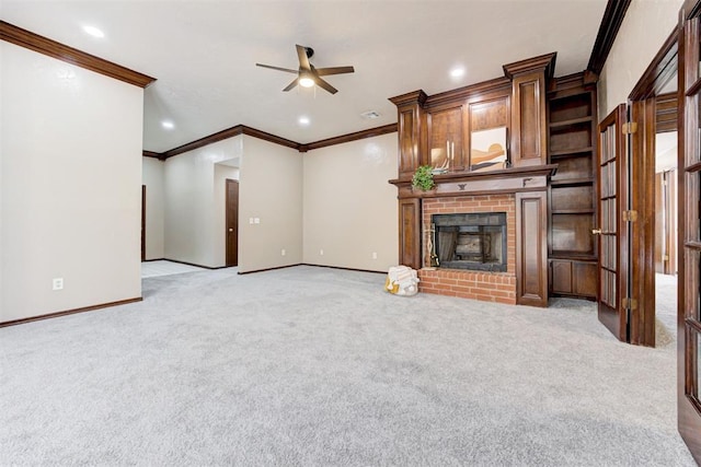 unfurnished living room with recessed lighting, light colored carpet, a fireplace, and baseboards