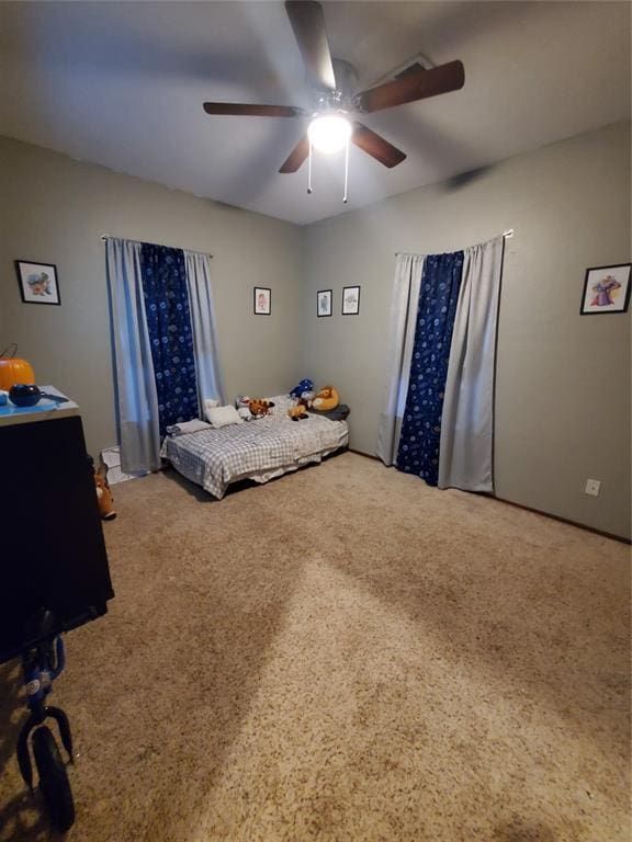 bedroom featuring ceiling fan and carpet flooring