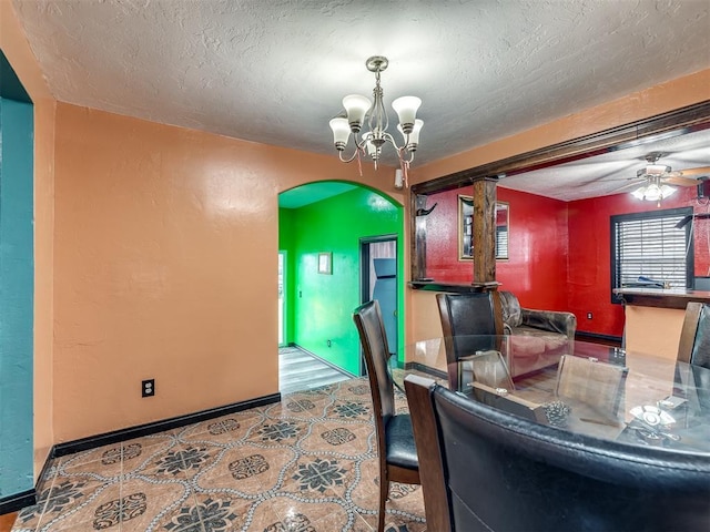 interior space with ceiling fan with notable chandelier and a textured ceiling