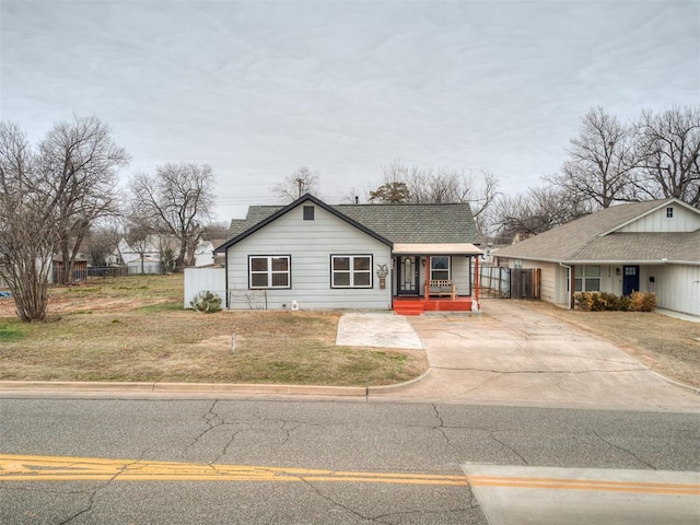 view of front of house with a porch and a front lawn