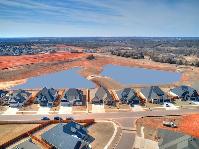 birds eye view of property with a residential view