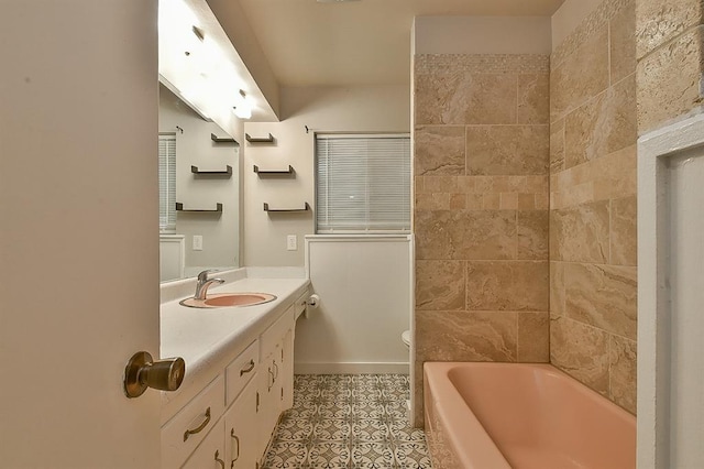 bathroom featuring vanity, tile patterned flooring, and tiled shower / bath combo