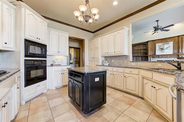 kitchen with light tile patterned floors, sink, light stone countertops, black appliances, and a kitchen island