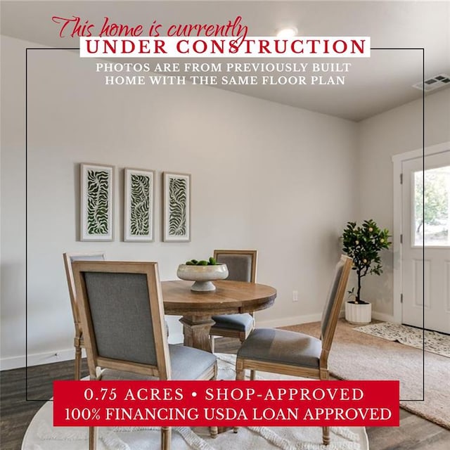 dining area with hardwood / wood-style floors