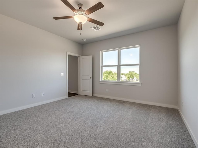 13136 Mannington Rd, Edmond, OK 73025 - unfurnished room with baseboards, carpet flooring, and ceiling fan