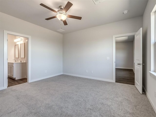 13136 Mannington Rd, Edmond, OK 73025 - unfurnished bedroom featuring dark colored carpet and baseboards
