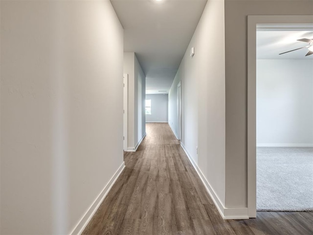 13136 Mannington Rd, Edmond, OK 73025 - corridor featuring dark wood finished floors and baseboards