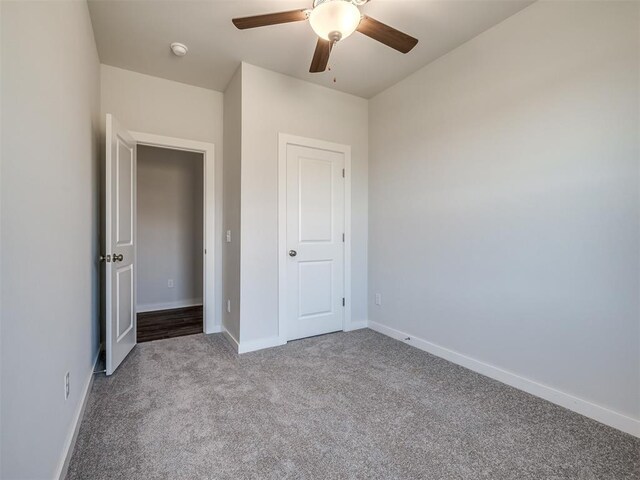13136 Mannington Rd, Edmond, OK 73025 - unfurnished bedroom featuring carpet flooring, baseboards, and a ceiling fan