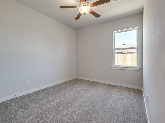 13136 Mannington Rd, Edmond, OK 73025 - carpeted empty room featuring ceiling fan and baseboards